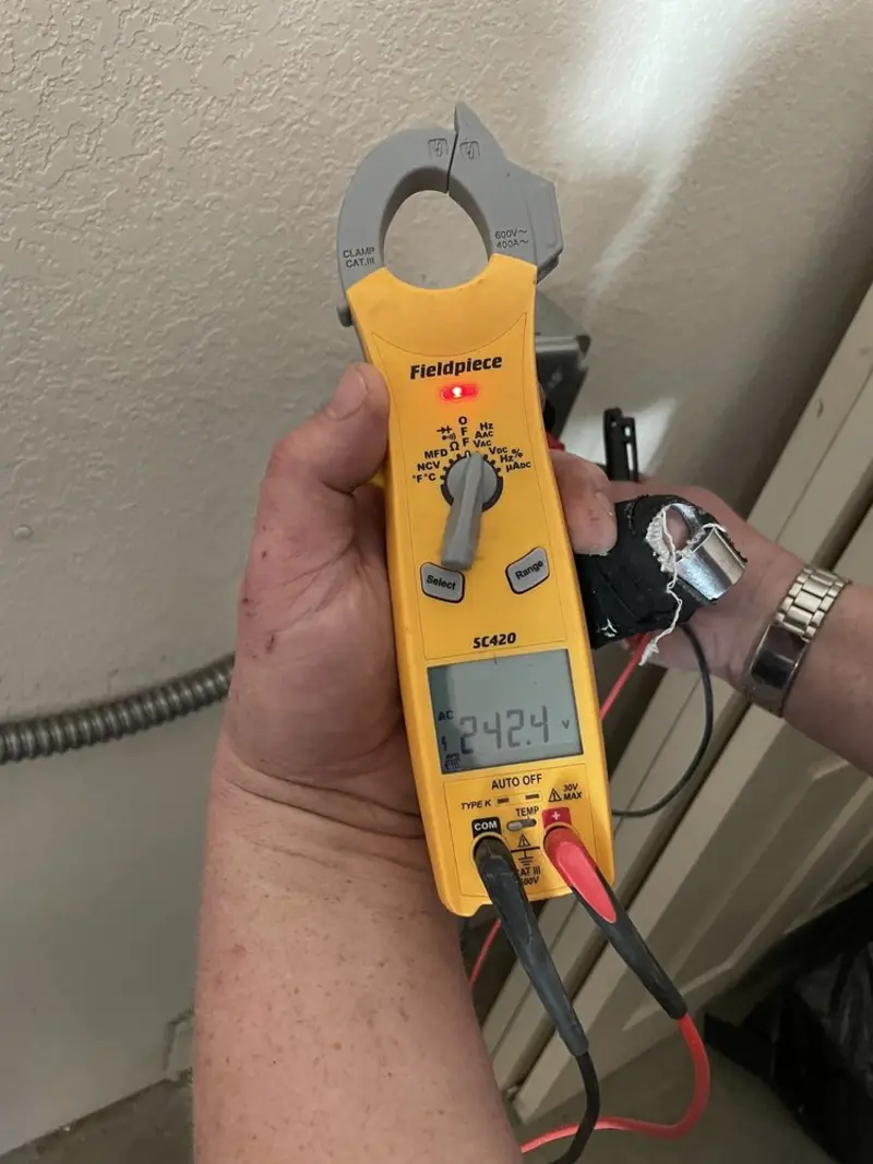 Voltage testing with clamp meter during Electrical Installation Services in Lower Nazareth